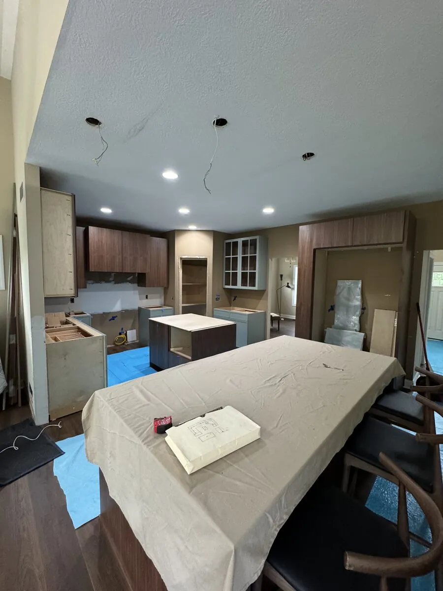 Cabinetry in place across the kitchen